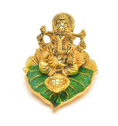 Elite Brass Metal Ganesh Ji Sitting on The Green Leave with Diya Deepak , Golden Decorative Showpiece - 9 cm  (Brass, Gold) - All Inclusive Family Treasures