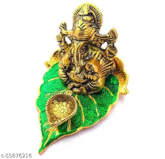 Elite Brass Metal Ganesh Ji Sitting on The Green Leave with Diya Deepak , Golden Decorative Showpiece - 9 cm  (Brass, Gold) - All Inclusive Family Treasures